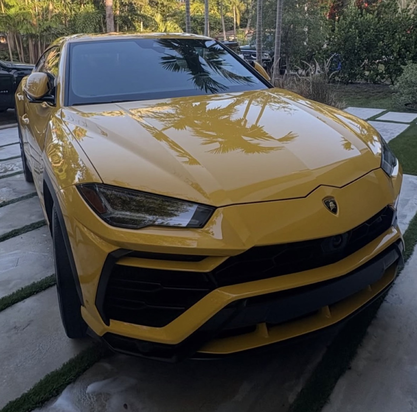 Yellow Lamborghini Urus with a mirror-gloss finish